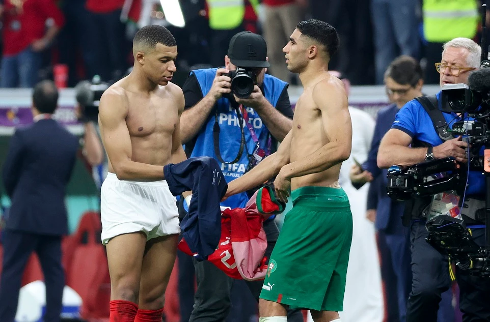 Kylian Mbappe of France exchanges his jersey with Achraf Hakimi of